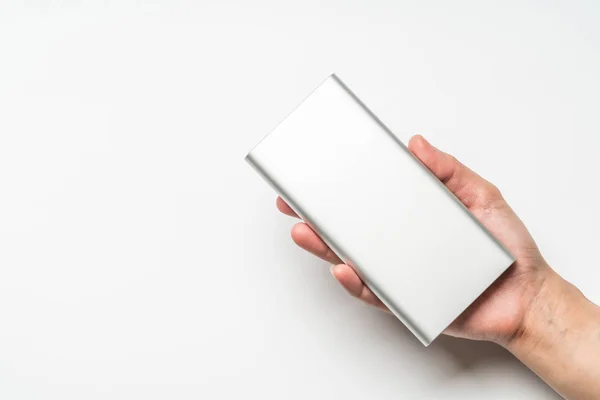 White silver power bank on hand isolate. save energy and reduce energy efficiency concept — Stock Photo, Image