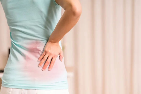 Back pain at home. women suffer from backache. healthcare and medical concept — Stock Photo, Image
