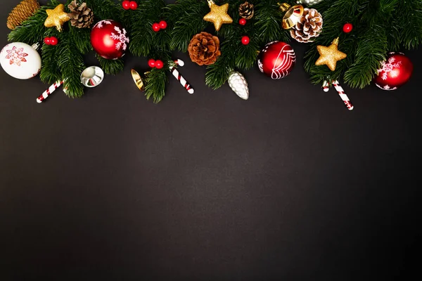 Christmas pine tree with xmas decoration on black background — Stock Photo, Image