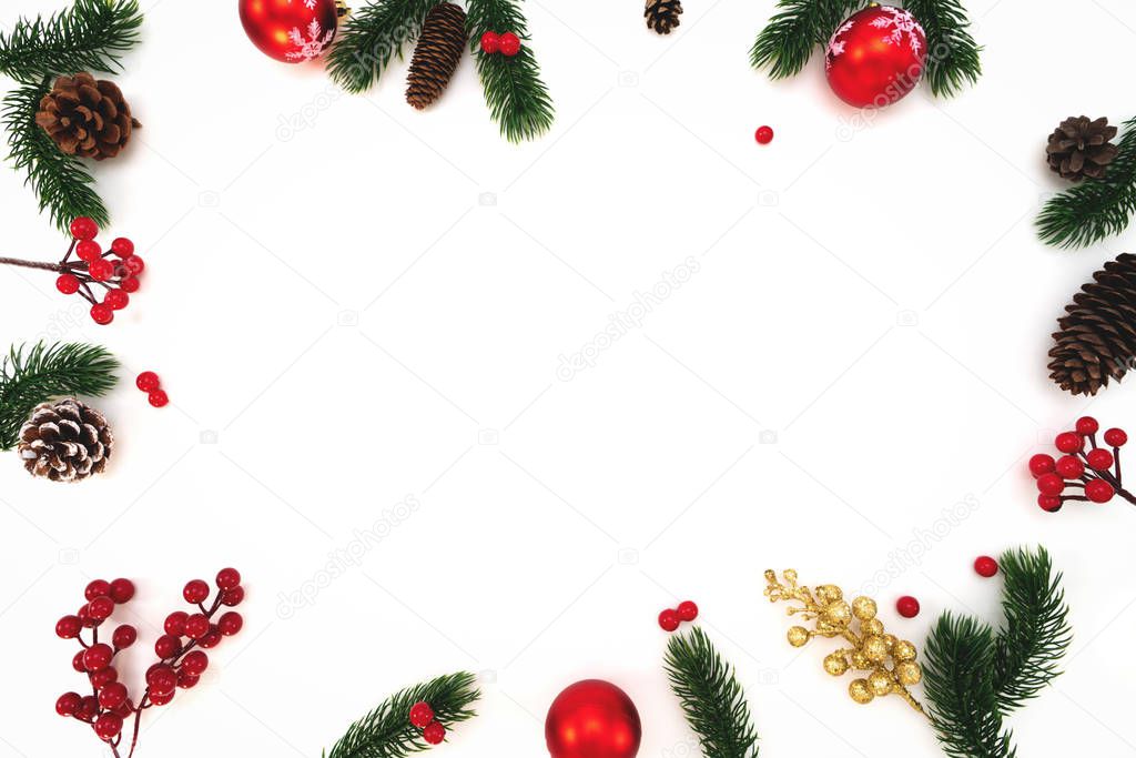 Christmas composition. Christmas ball, pine cones, fir branches on white background. Flat lay, top view, copy space