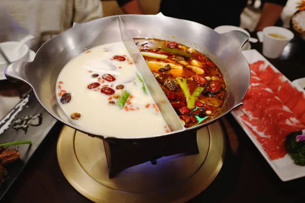 Chinese Hotpot shabu spicy and sour soup with meat and seafood, Suki Chinese style - selective focus — Stock Photo, Image