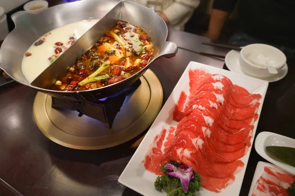 Chinese Hotpot shabu spicy and sour soup with meat and seafood, Suki Chinese style - selective focus — Stock Photo, Image
