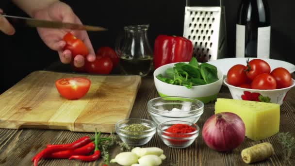 Knife Cuts Tomato On Wooden Board — Stock Video