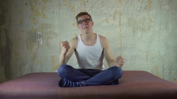 Handsome man watching football match in his living room — Stock Video