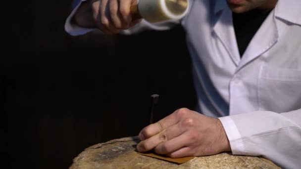 Manually cutting of skin during craft manufacturing leather goods. Workshop of skinner, close-up shot showing hands of master and production process — Stock Video