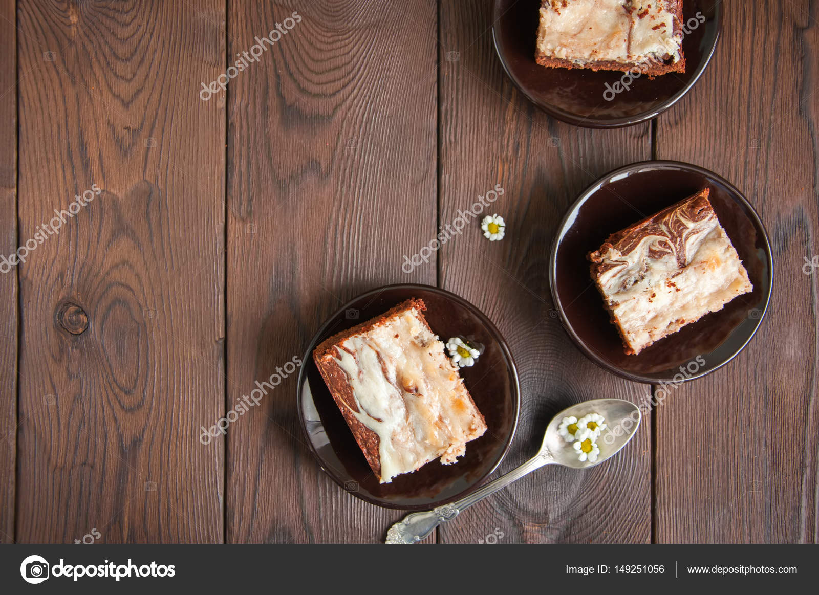 Brownie Cheesecake Squares In A Brown Small Plates On Wooden B Brownie Cheesecake Squares In A Brown Small Plates On Wooden B Stock Photo