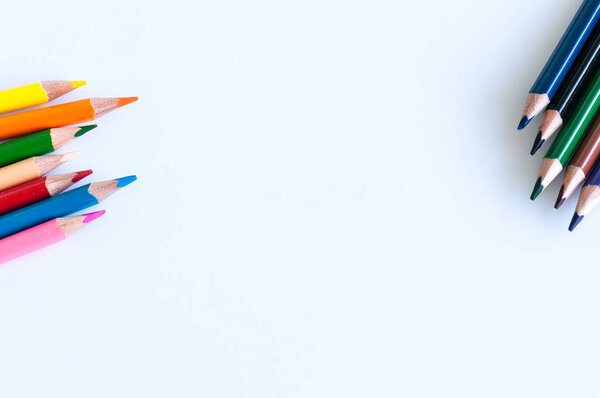 Group of colorful pencils on a white background. Close up and co