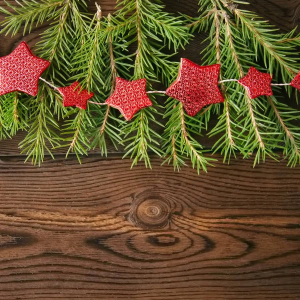 Boże Narodzenie bezszwowe. Gałęzie drzewa jodły i czerwona gwiazda garland na — Zdjęcie stockowe