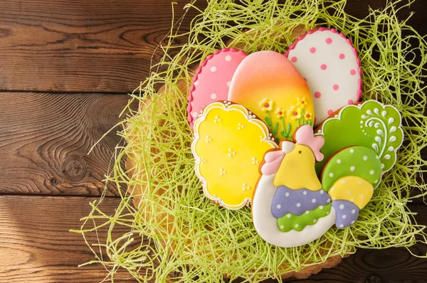 Colorful Easter egg cookies. Wooden background. Top view. — Stock Photo, Image