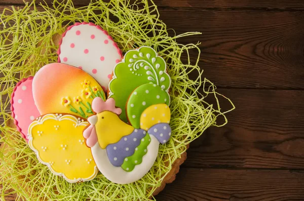 Colorful Easter egg cookies. Wooden background. Top view. — Stock Photo, Image