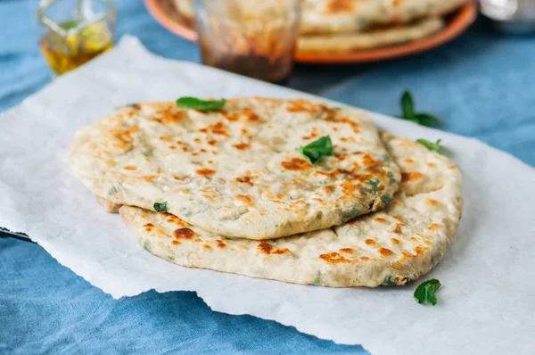 Indian flatbread - Herb stuffed paratha on a baking paper — Stock Photo, Image