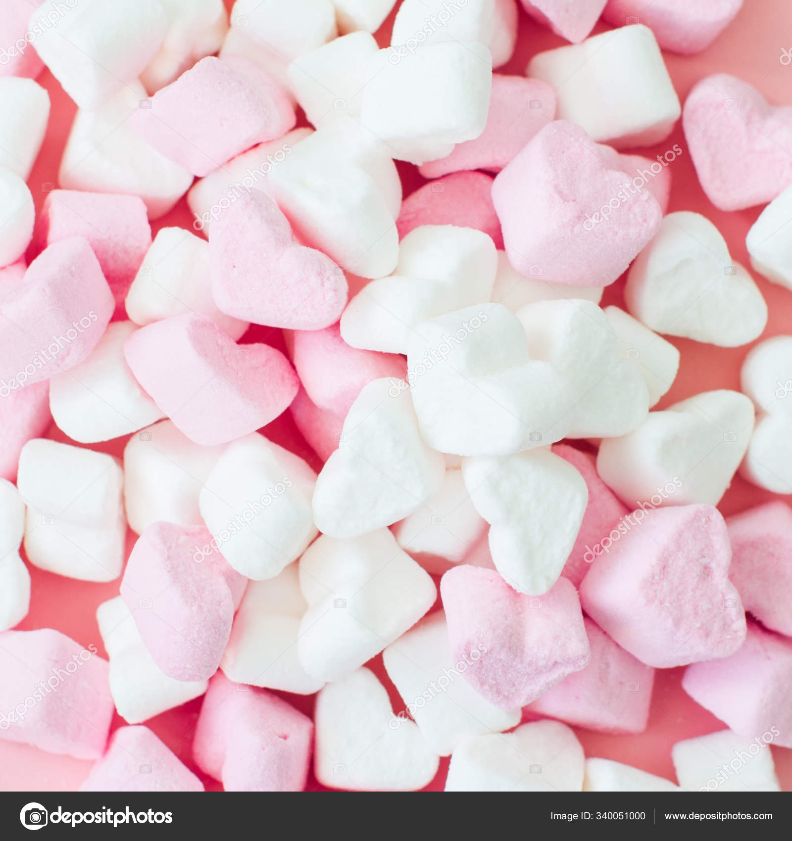 Pink fluffy heart shaped marshmallows candy background. Stock Photo by  ©galiyahassan 340051000