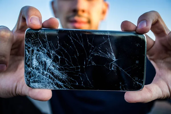 Smartphone with cracked screen — Stock Photo, Image