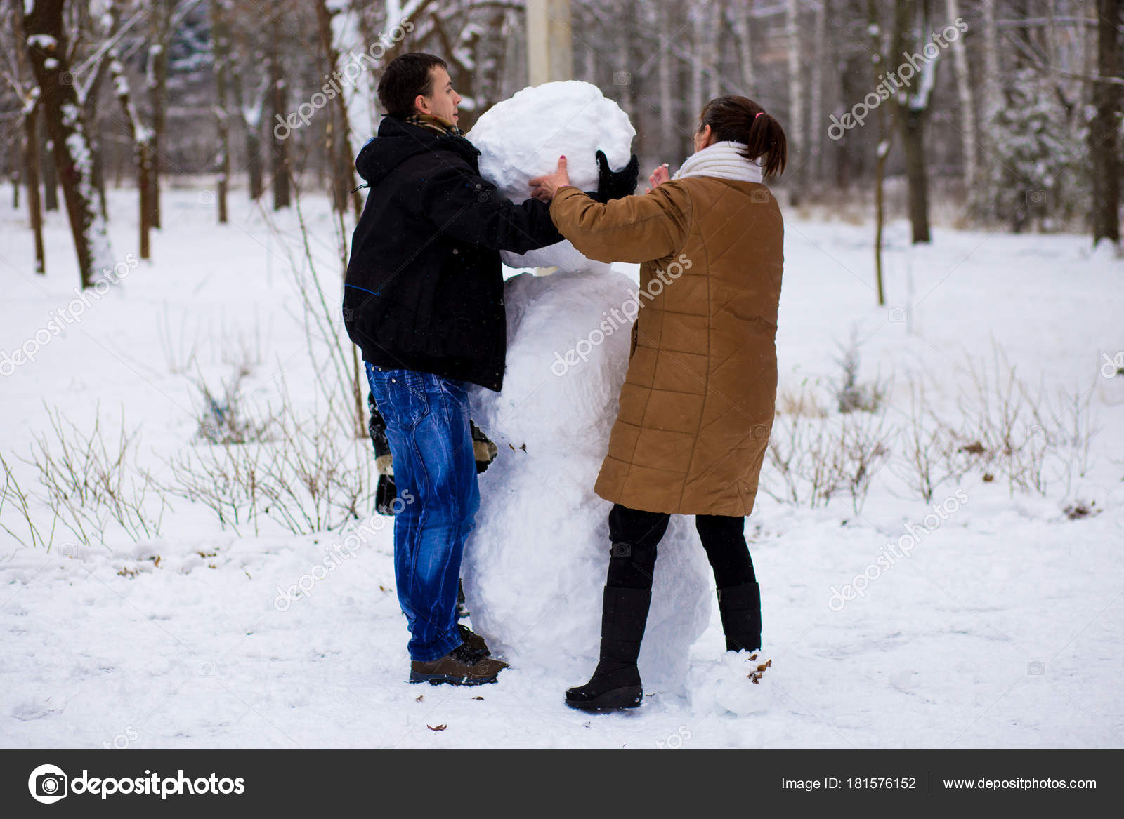 Family Sculpting Snowmen In Winter Park Sculpt Big Real Snowman Happy Family