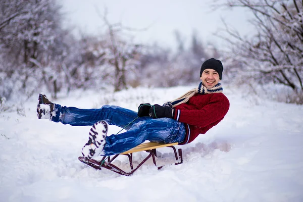 Cheerful Young Man Having Fun Sleigh Snowy Weather — Stock Photo, Image