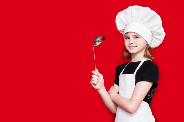 Menina Feliz Uniforme Chef Mantém Colher Isolada Vermelho Chefe Cozinha — Fotografia de Stock
