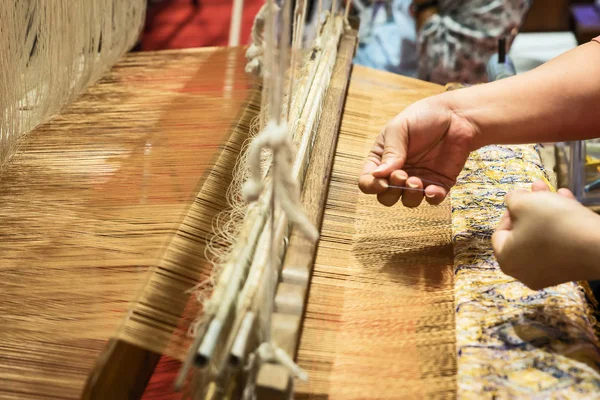 Traditional Thai silk weaving.