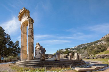 Ruins of Athena pronaia temple in Delphi archaeological site in Greece clipart