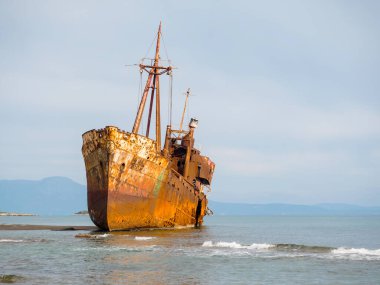 Old rusty shipwreck Agios Dimitrios on the beach in Githeio,Peloponnese, Greece clipart