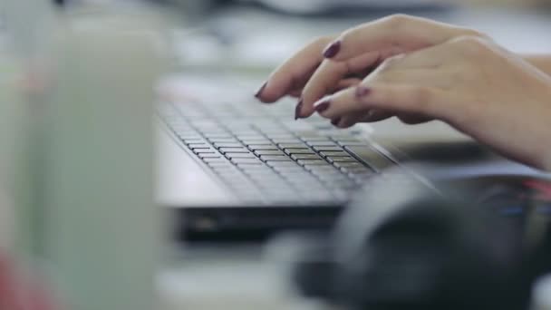 Programmer working on a laptop keyboard, close-up — Stock Video