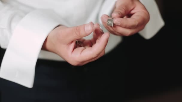 Young man put on cufflink. Dressing for celebration event, business meeting or wedding. 2019 — Stok video