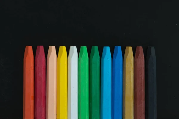 Row of wax crayons — Stock Photo, Image