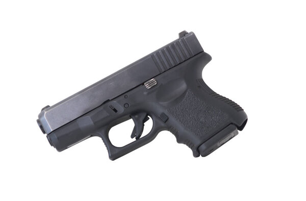 Пистолет на белом фоне слева
