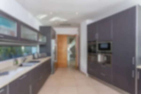 Blurred background of modern kitchen. Inside house