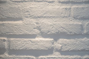 Arka plan, evin duvarı, taştan yapılmış tuğla. Arkaplan. Beyaz