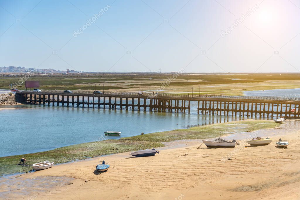 An old bridge on Faro Beach, across the Ria Formosa. Portugal Algarve