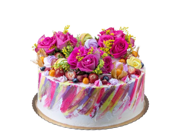 Festive cake with fruit and marshmallow flowers