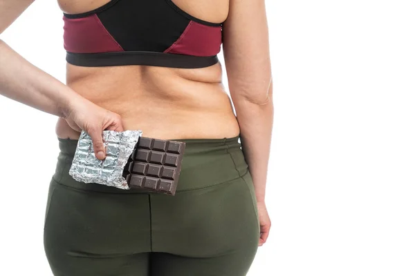 Dikke Vrouw Met Chocolade Haar Rug Conceptueel Beeld Van Obesitas — Stockfoto