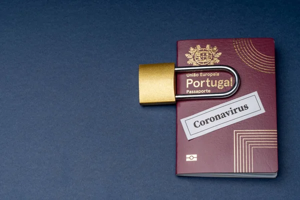 Portuguese european travel passport with padlock on blue background. — Stock Photo, Image