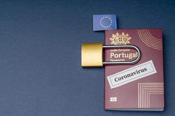 Portuguese european travel passport with padlock on blue background. — Stock Photo, Image