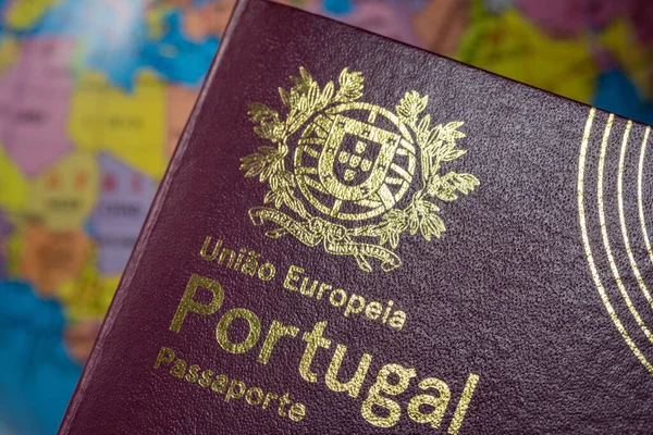 Portuguese international European Union foreign passport. On the background of the earth. Customs concept. — Stock Photo, Image
