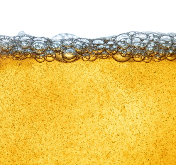 Gul vätska med ölskum, eller industriolja från olja. Mänsklig fetma. Närbild. — Stockfoto