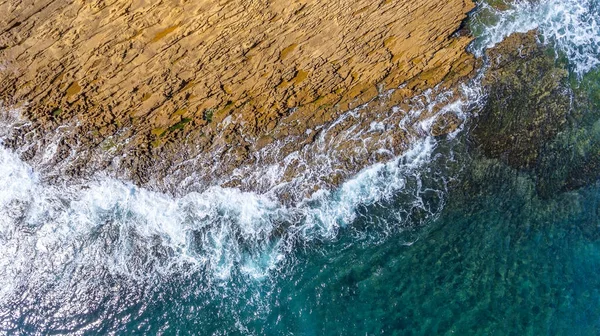 Aerial, landscape of waves of the Pacific Atlantic Ocean, which are washed by rocky shores. Portugal. — Stock Photo, Image
