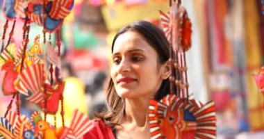 Happy women shopping for souvenirs at street market