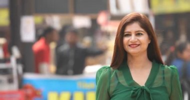 Beautiful woman looking at camera at street market