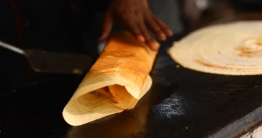 Cooking masala dosa at Surajkund Mela food stall