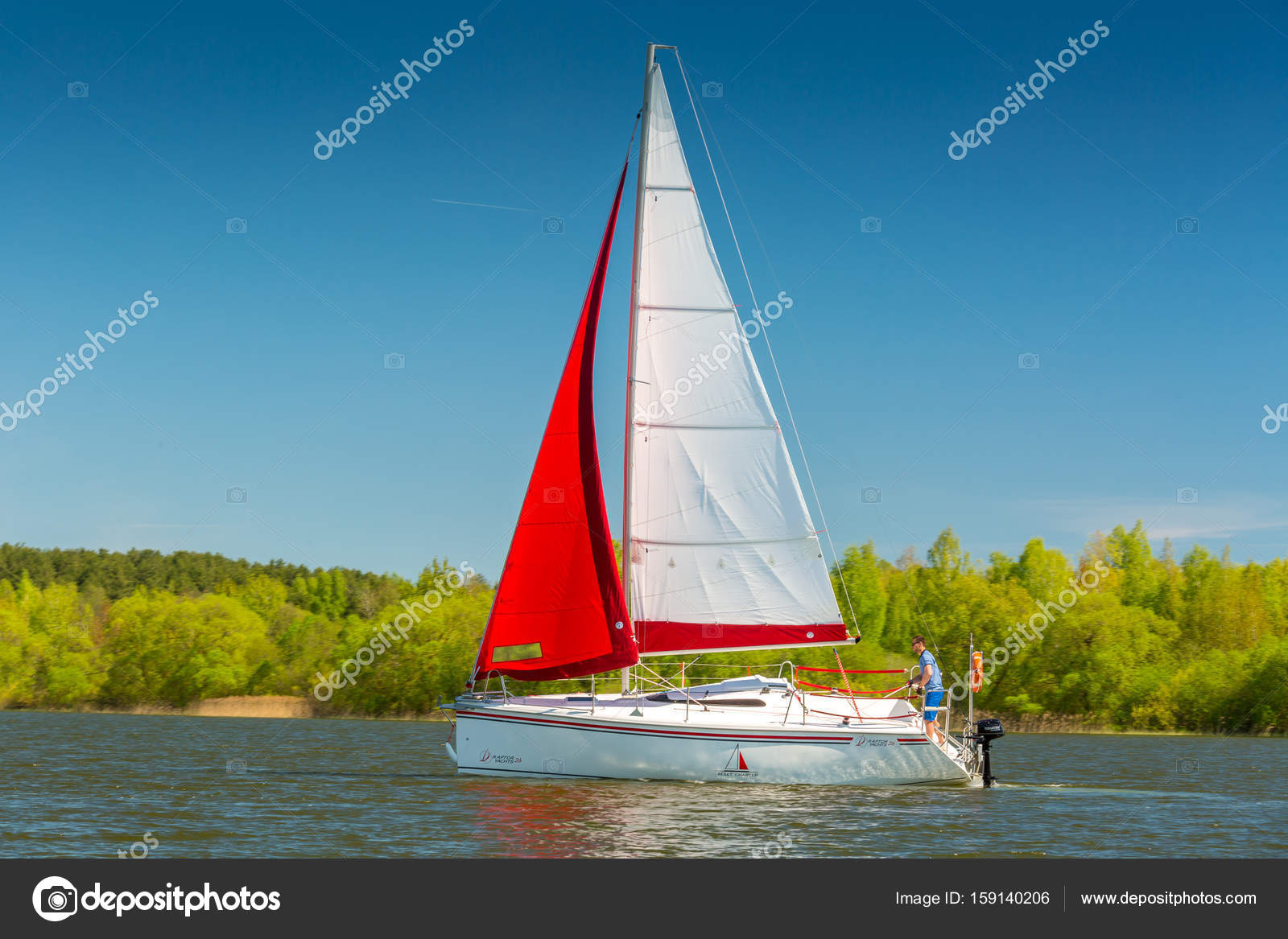 Yacht with red and white sail – Stock Editorial Photo © dimid_by #159140206