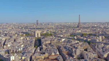 PARIS, FRANCE - MAY, 2019: Aerial drone view of Triumphal Arch and and Eiffel tower in historical city centre.