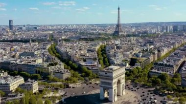 PARIS, FRANCE - MAY, 2019: Aerial drone view of Triumphal Arch and and Eiffel tower in historical city centre.