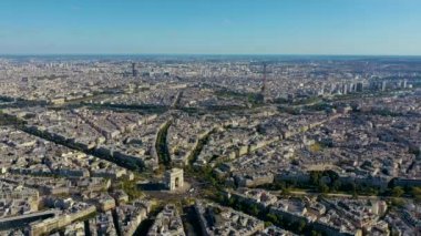PARIS, FRANCE - MAY, 2019: Aerial drone view of Triumphal Arch and and Eiffel tower in historical city centre.