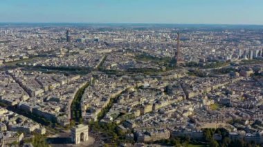 PARIS, FRANCE - MAY, 2019: Aerial drone view of Triumphal Arch and and Eiffel tower in historical city centre.