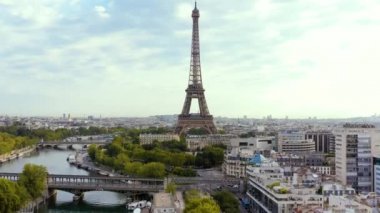 PARIS, FRANCE - MAY, 2019: Aerial drone view of Eiffel tower and Seine river in historical city centre from above.