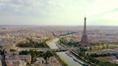PARIS, FRANCE - MAY, 2019: Aerial drone view of Eiffel tower and Seine river in historical city centre from above.