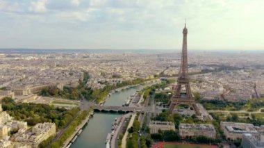PARIS, FRANCE - MAY, 2019: Aerial drone view of Eiffel tower and Seine river in historical city centre from above.