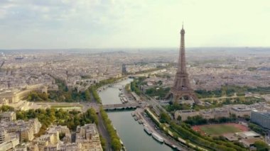 PARIS, FRANCE - MAY, 2019: Aerial drone view of Eiffel tower and Seine river in historical city centre from above.
