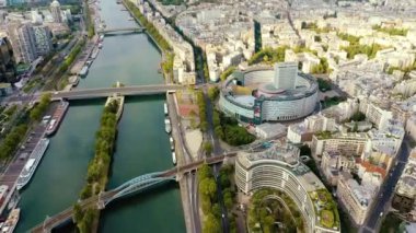 PARIS, FRANCE - MAY, 2019: Aerial drone view of the moder architecture district on Seine riverside in city centre.